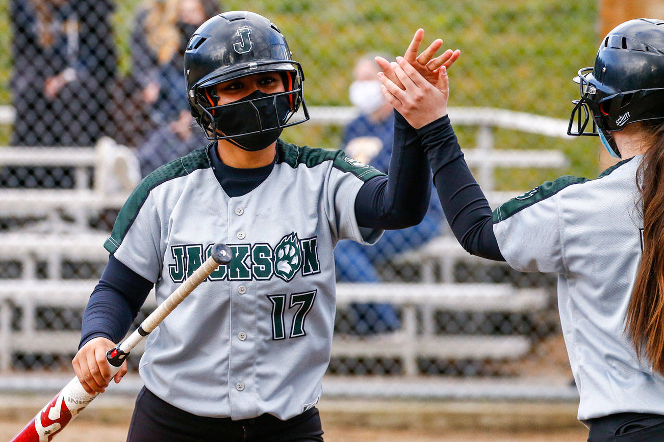 Jackson's Helena Ah-Loe is high-fived after a home run against Everett Thursday afternoon at Henry M. Jackson High School in Mill Creek on April 8, 2021. Jackson dominated Everett, 15-0. (Kevin Clark / The Herald)