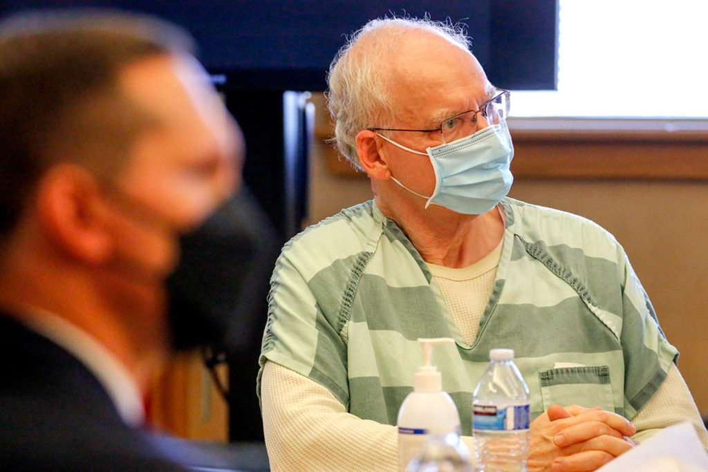 Deputy prosecutor Matt Hunter (left) and Simeon Berkley listen as Berkley is sentenced to 22 years in prison for the second-degree murder of Steven Whitmarsh in 2019. (Kevin Clark / The Herald)
