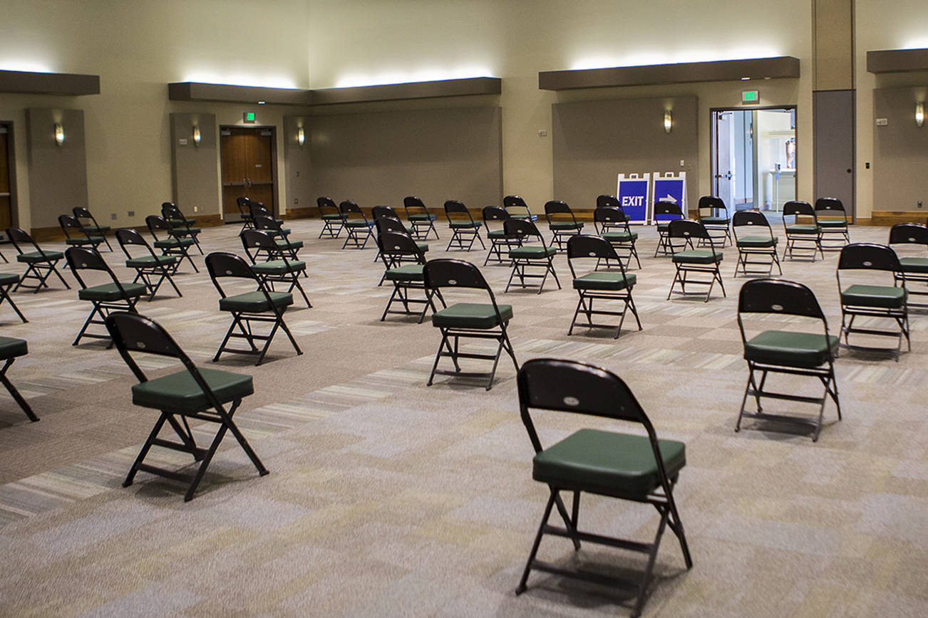 A large waiting area for people after receiving their vaccinations at Angel of the Winds Arena on Tuesday, April 6, 2021 in Everett, Wa. (Olivia Vanni / The Herald)