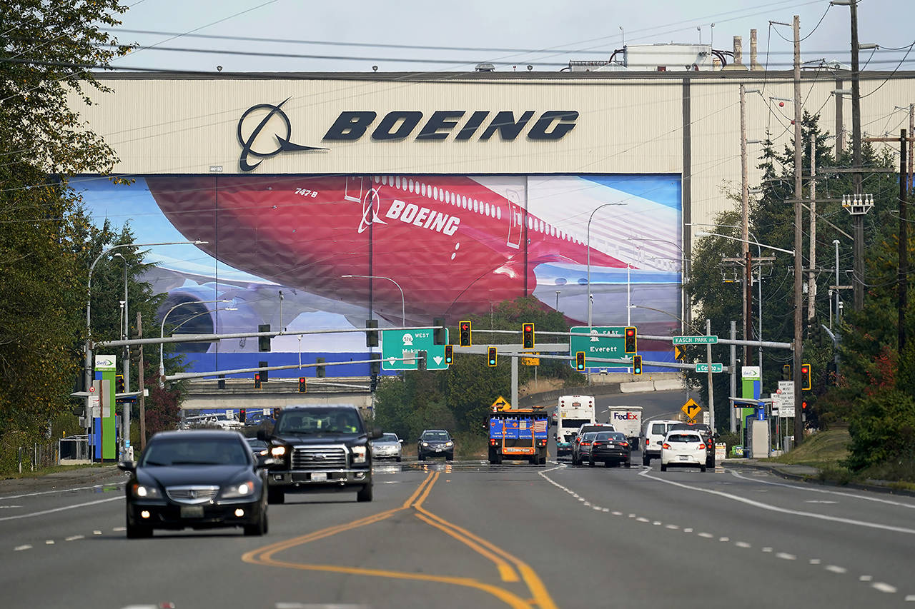 In this 2020 photo, traffic passes the Boeing airplane production plant in Everett. (AP Photo/Elaine Thompson, file)