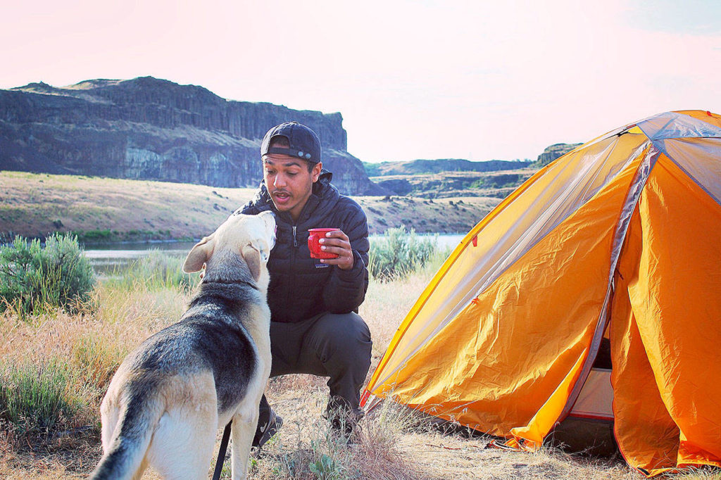 Teddy Wingo backpacks with Indie at Ancient Lakes near Quincy. (Aki Nguyen)
