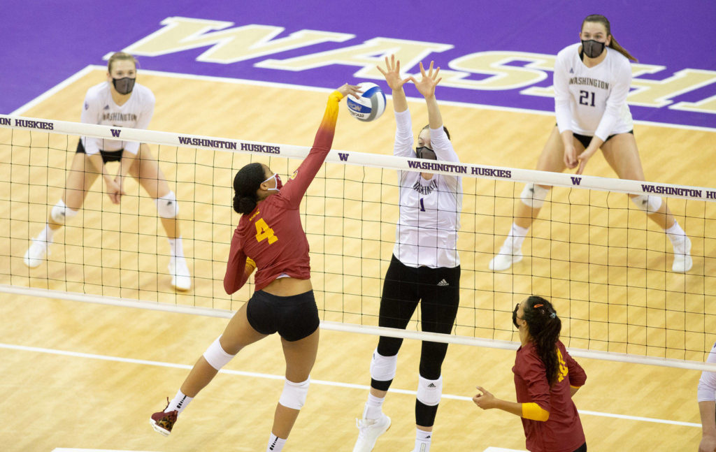 Washington’s Lauren Sanders, a Glacier Peak alum, blocks a spike attempt during a match against USC on March 14, 2021, in Seattle. (Scott Eklund/Red Box Pictures)
