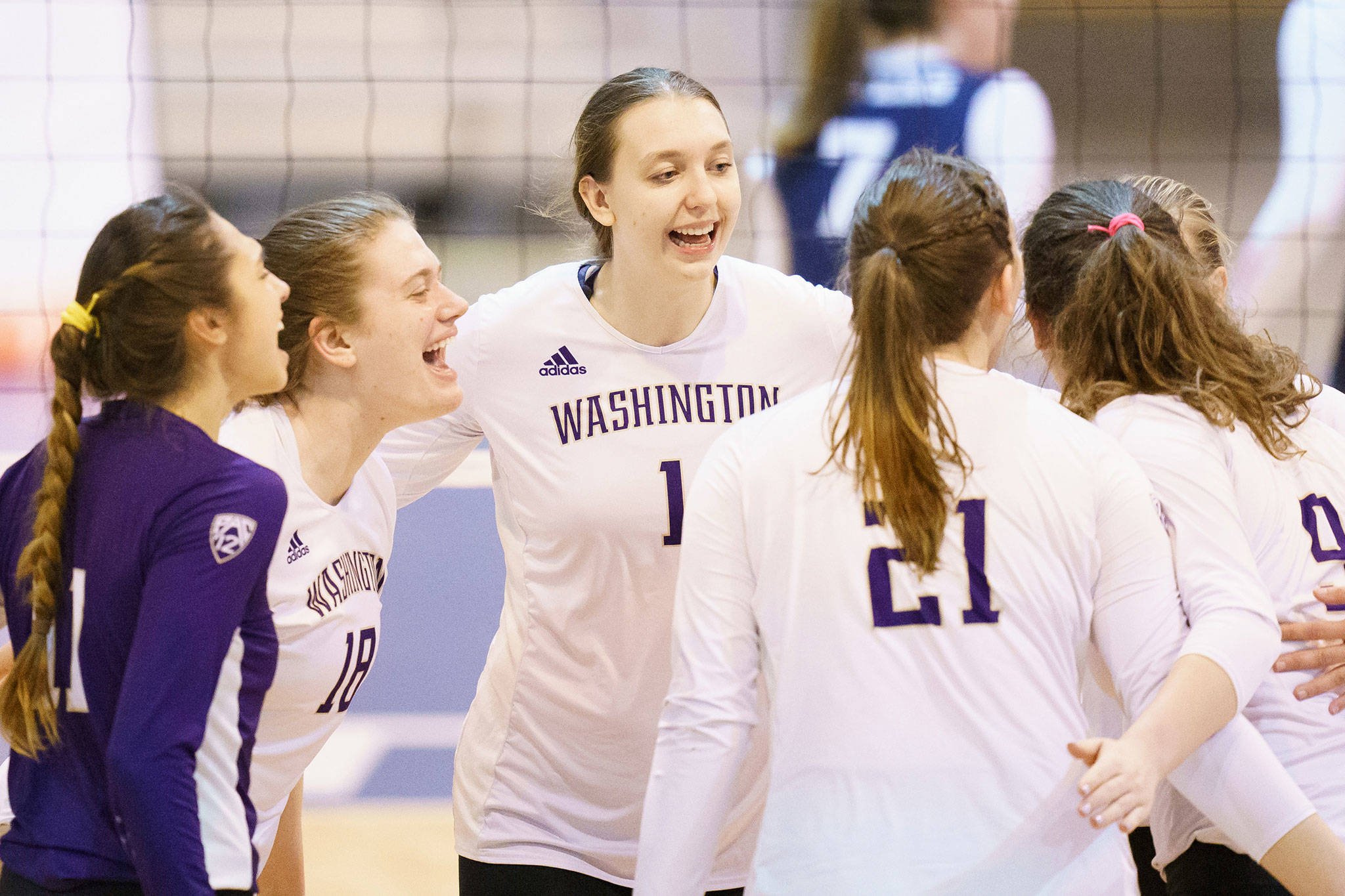 Washington’s Lauren Sanders (center) celebrates with teammates during an NCAA Tournament game against Dayton on April 15, 2021, in Omaha, Neb. (Mark Kuhlmann/NCAA Photos)