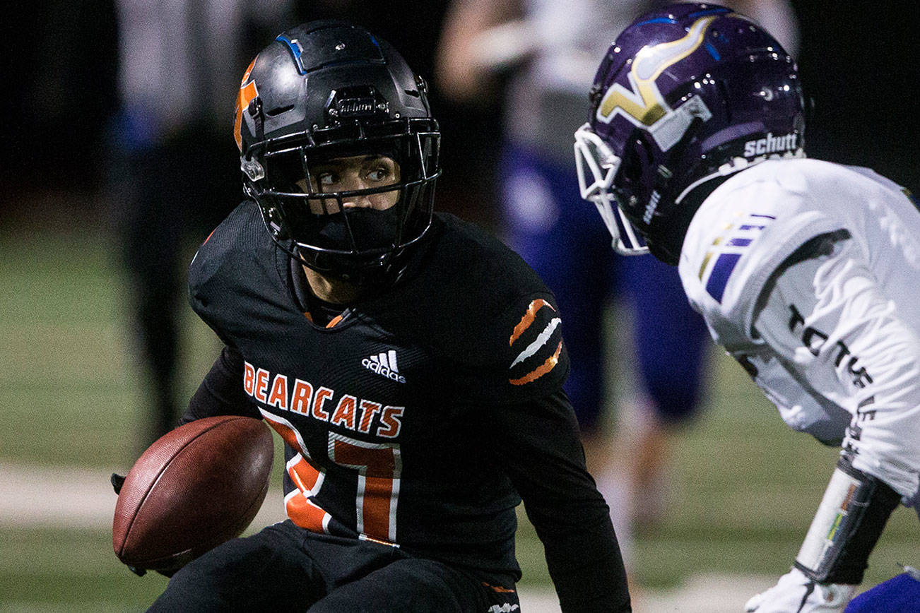 Monroe's Trey Lane runs the ball during the game against Lake Stevens on Friday, March 12, 2021 in Monroe, Wa. (Olivia Vanni / The Herald)