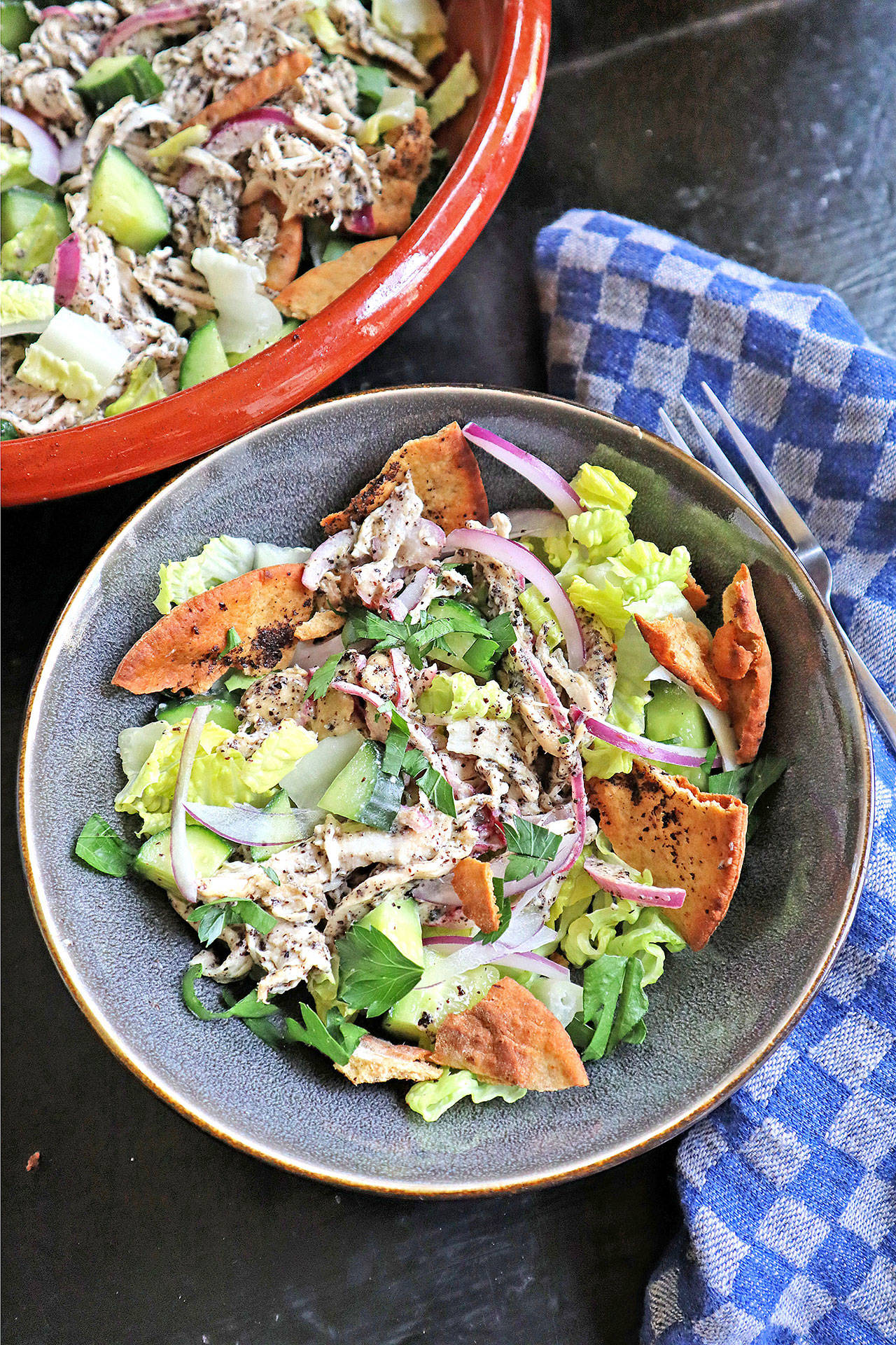 Fattoush is a chopped Levantine salad made with stale pita. This includes shredded chicken tossed in a citrusy tahini-sumac dressing. (Gretchen McKay / Post-Gazette)