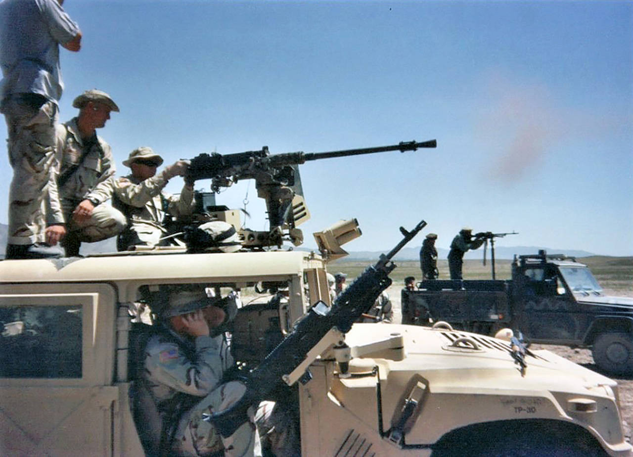 Drew James fires a Russian-built .50 caliber machine gun as he trains locals during his 2003 deployment to Afghanistan. (Contributed photo)