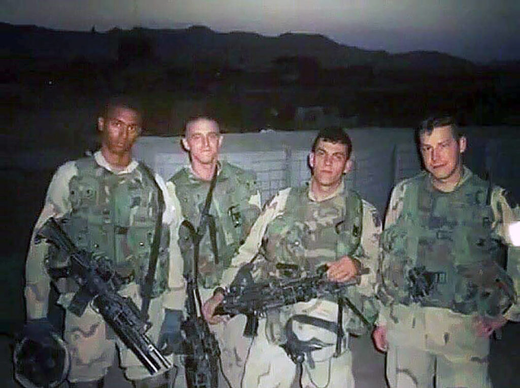 Drew James (second from right) with fellow soldiers at Shkin, a U.S. firebase in Afghanistan, in 2003. (Contributed photo)

