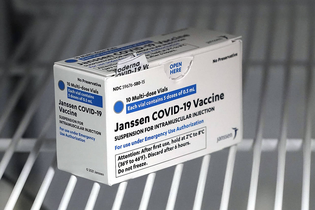 A box of the Johnson & Johnson COVID-19 vaccine is shown in a refrigerator at the Yakima Valley Farm Workers Clinic in Toppenish. (AP Photo/Ted S. Warren, file)