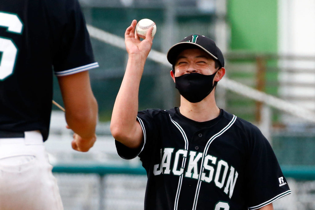 Jackson’s Anthony Kodama returns a ball after an out against Cascade during a game April 23, 2021, at Everett Memorial Stadium. (Kevin Clark / The Herald)
