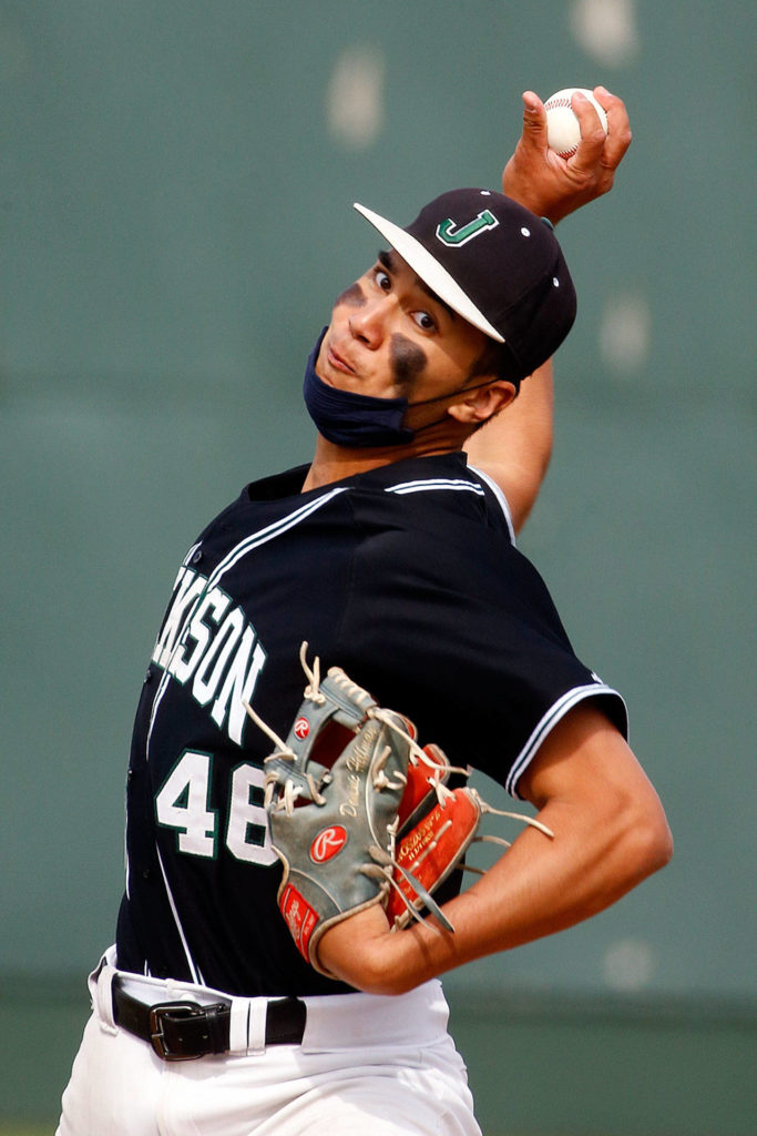 Jackson’s Dominic Hellman throws a pitch against Cascade during a game April 23, 2021, at Everett Memorial Stadium. (Kevin Clark / The Herald)
