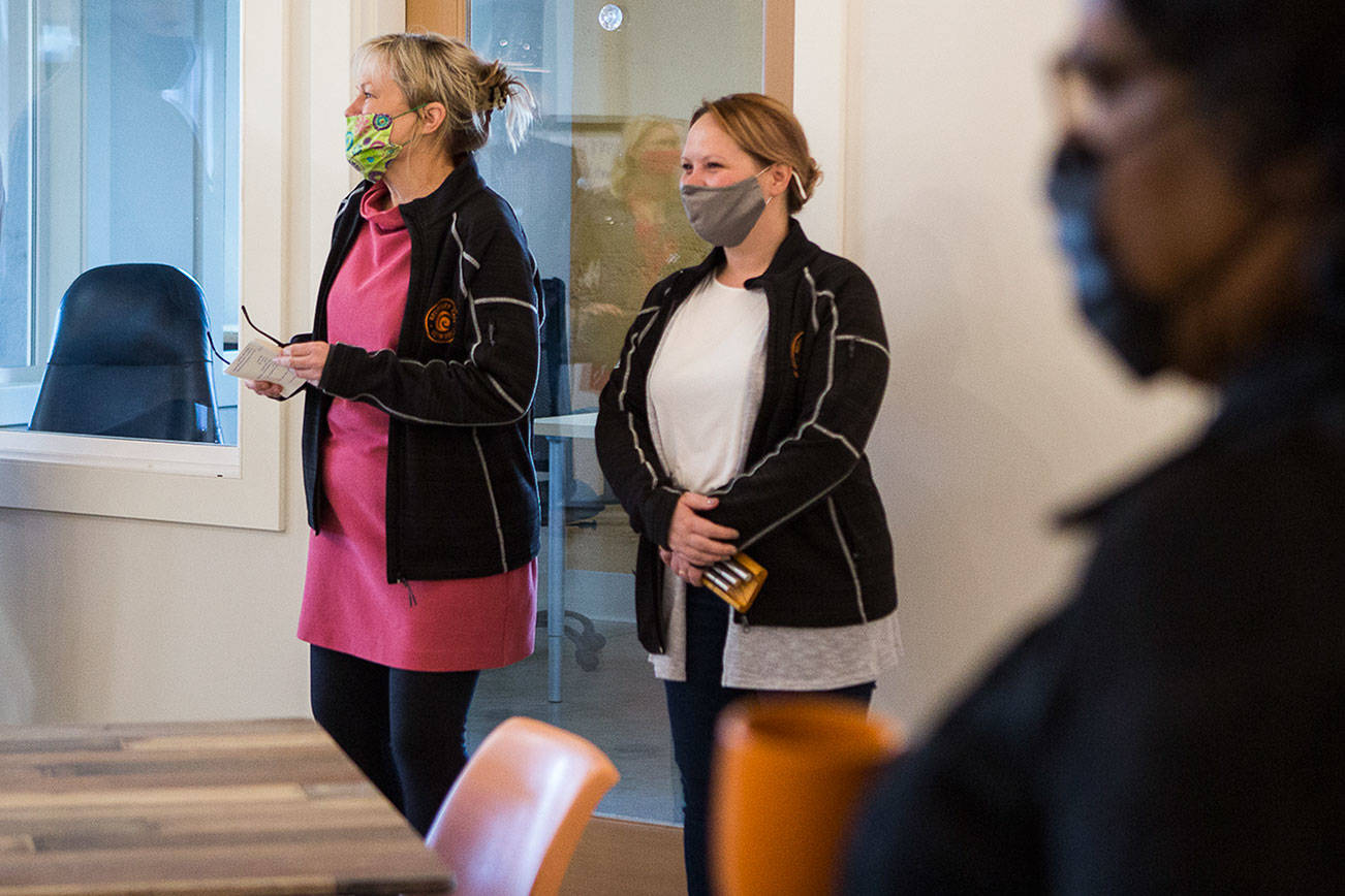 Wendy Grove, center, founder and executive director of the Recovery Cafe in Everett, speaks during the grand opening on Wednesday, April 28, 2021 in Everett, Wash. (Olivia Vanni / The Herald)