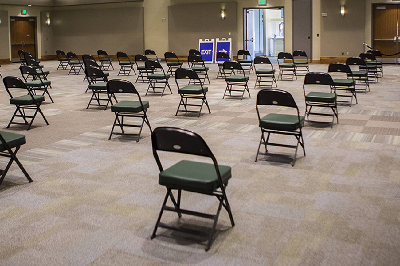 A large waiting area for people after receiving their vaccinations at Angel of the Winds Arena on Tuesday, April 6, 2021 in Everett, Wa. (Olivia Vanni / The Herald)