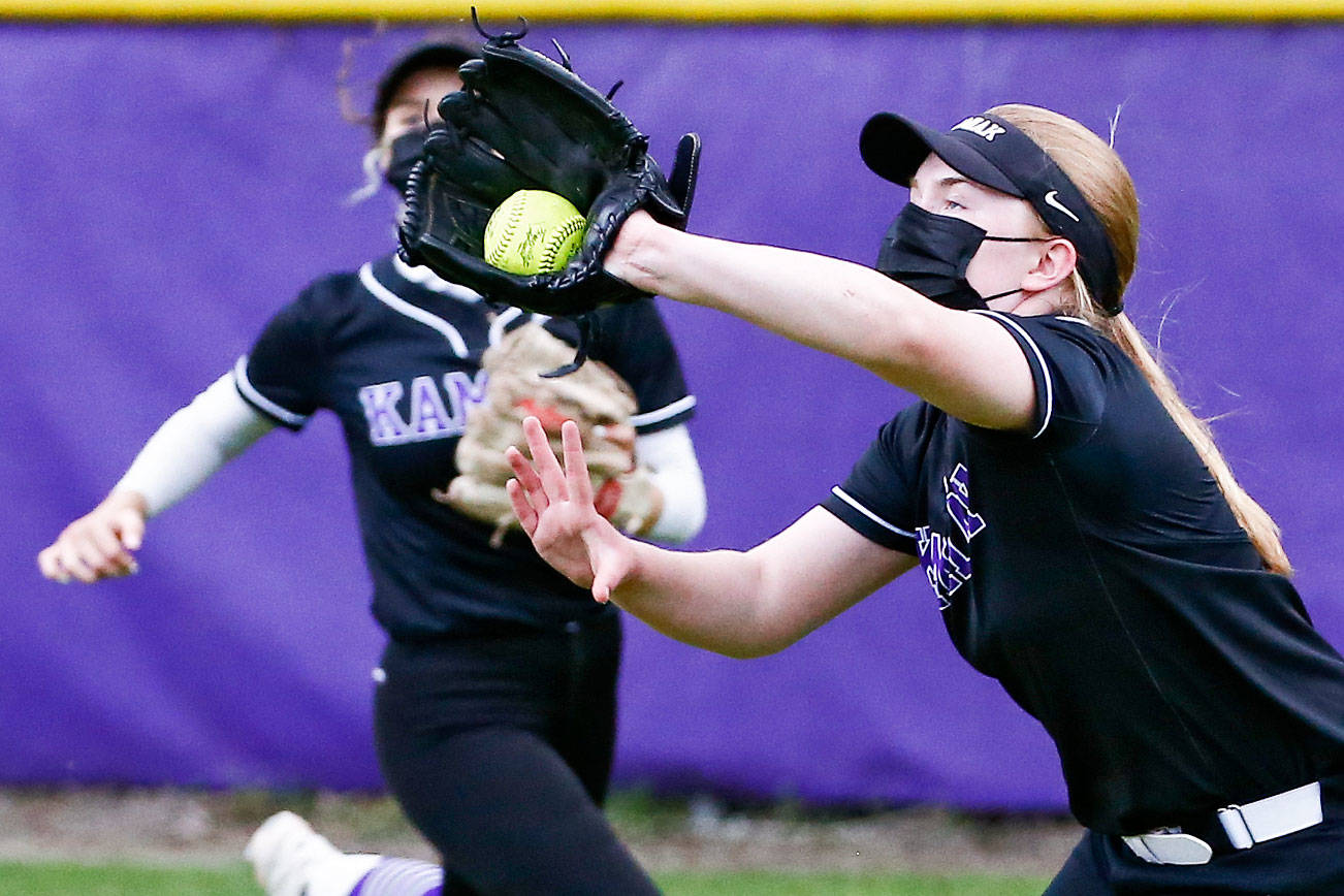 Kamiak's Sam Porter makes a catch Friday afternoon at Kamiak High School in Mukilteo on April 30, 2021. The Knights won 2-0. (Kevin Clark / The Herald)