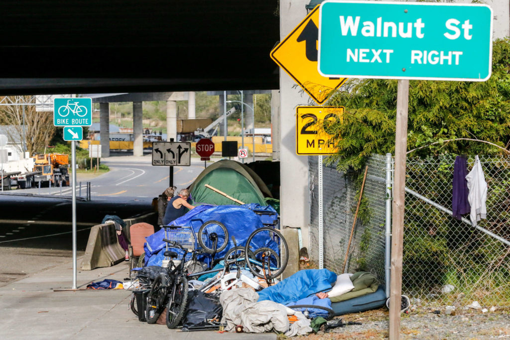 Everett’s new no-sit, no-lie ordinance won’t take effect for months, but most of people who lived on the streets and sidewalks of Smith Avenue have moved on. For a few weeks, some lived under an I-5 overpass on Hewitt Avenue. (Kevin Clark / The Herald)
