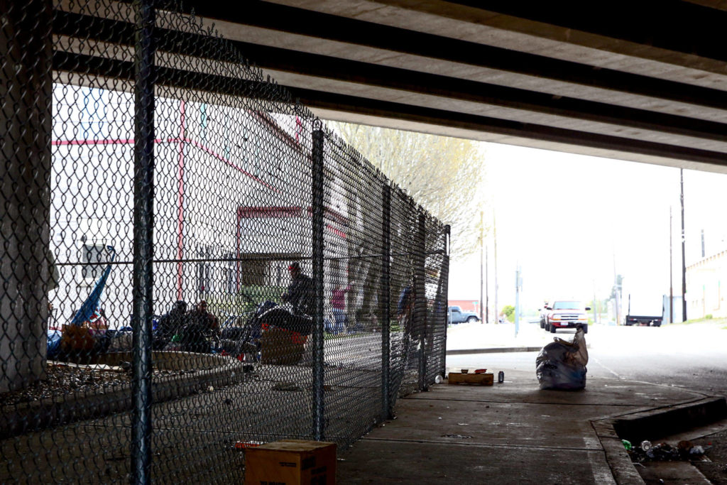 Everett’s new no-sit, no-lie ordinance won’t take effect for months, but only a few of the dozens of people who lived on Smith Avenue remain. (Kevin Clark / The Herald) 
