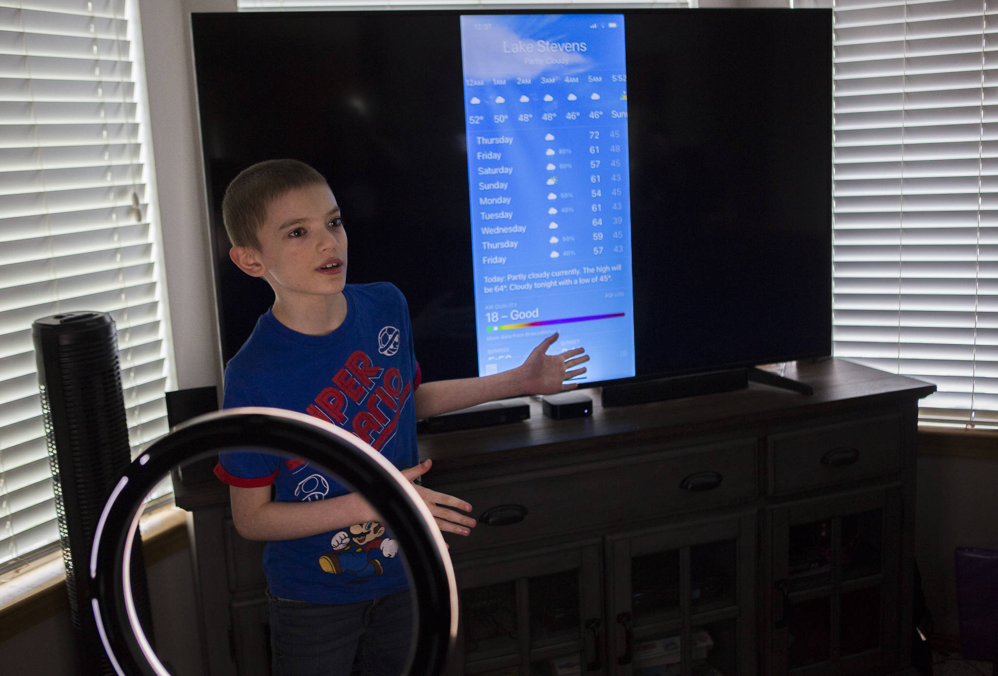 David Stowell, 10, runs through his daily local weather report from his home in Lake Stevens. (Olivia Vanni / The Herald)