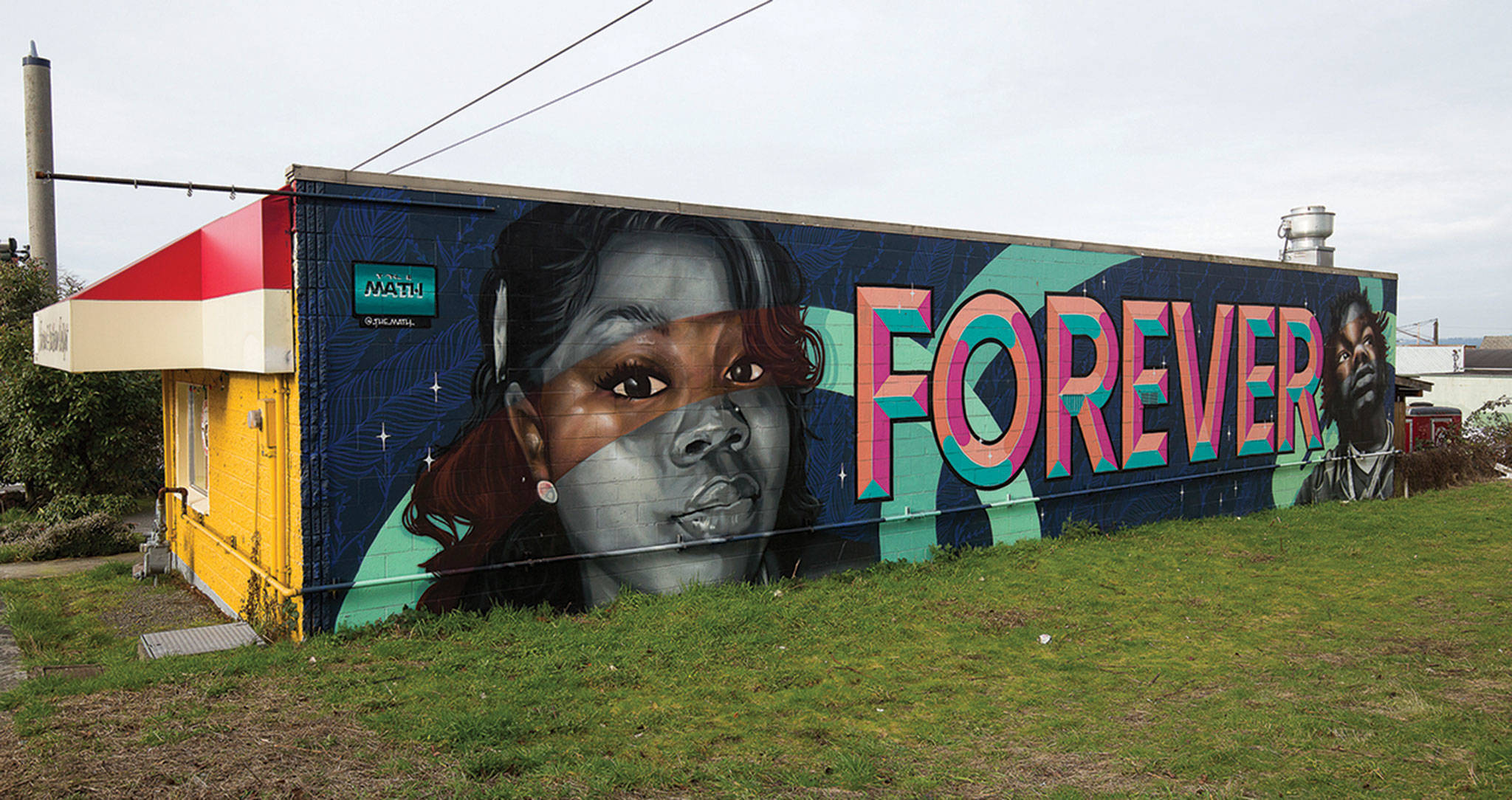 A mural on the building that houses Grandma’s in da Kitchen honors Breonna Taylor and Jatarius Tolbert. (Andy Bronson / The Herald)