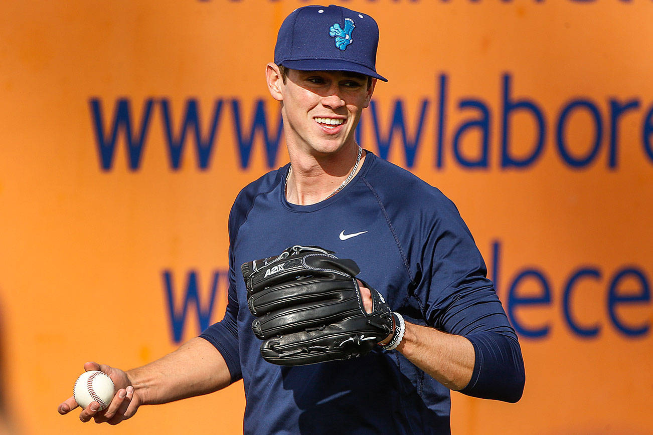 Emerson Hancock warms up Saturday afternoon during practice at Funko Field in Everett on May 1, 2021. (Kevin Clark / The Herald)