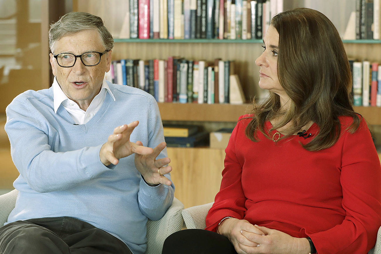 FILE - In this Feb. 1, 2018 file photo, Microsoft co-founder Bill Gates and his wife Melinda take part in an AP interview in Kirkland, Wash. Gates' non-profit Bill and Melinda Gates Foundation has given about $44 million to outside groups over the past two years to help shape new state education plans required under the 2015 law, according to an Associated Press 2018 analysis of its grants. (AP Photo/Ted S. Warren, file)