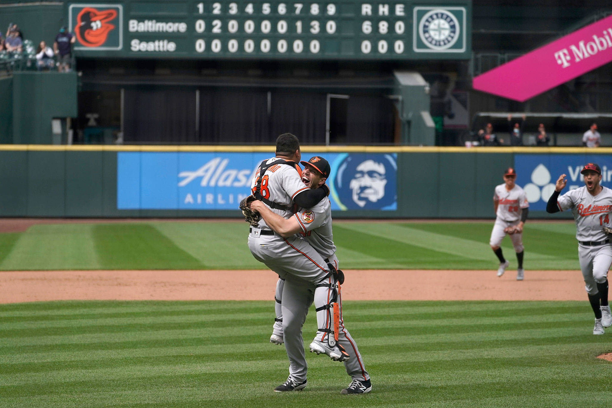 Orioles starting pitcher John Means (right) hugs catcher Pedro Severino after Means threw a no-hitter against the Mariners on May 5, 2021, in Seattle. (AP Photo/Ted S. Warren)