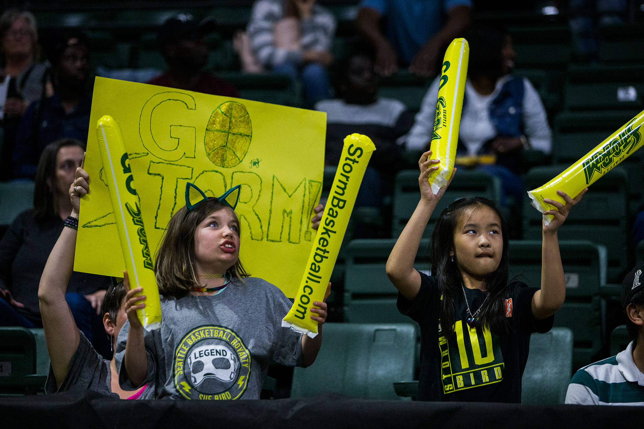 Seattle Storm fans cheer during a game against the Los Angeles Sparks in 2019 at Angel of the Winds Arena in Everett. (Olivia Vanni / The Herald)