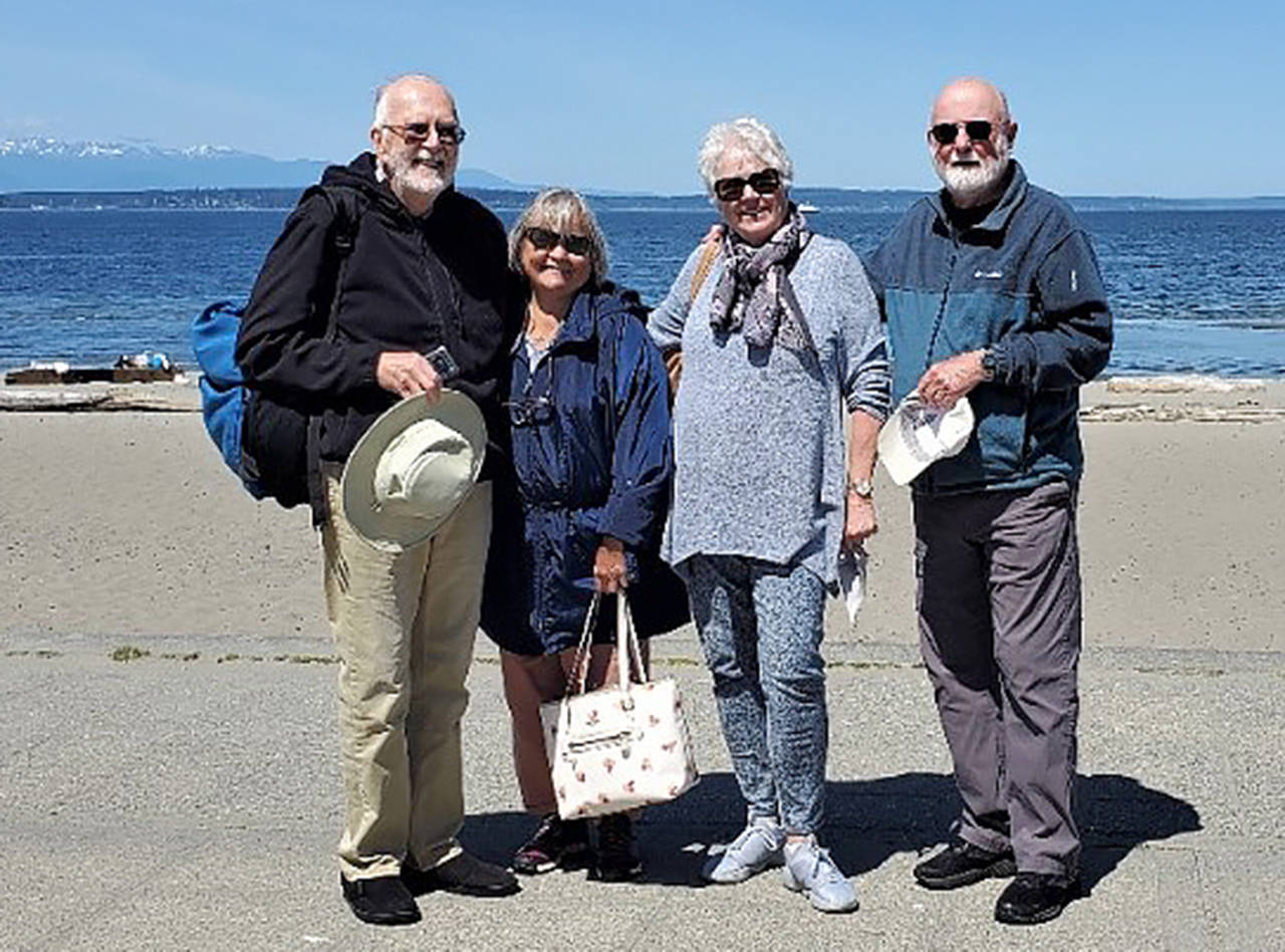Everett’s Jerry and Helga Hilson (couple on right) with David and Janice Peterson at Seattle’s Alki Beach Wednesday. As boys, Jerry Hilson and David Peterson were friends who attended school together in West Seattle through second grade. (Contributed photo)