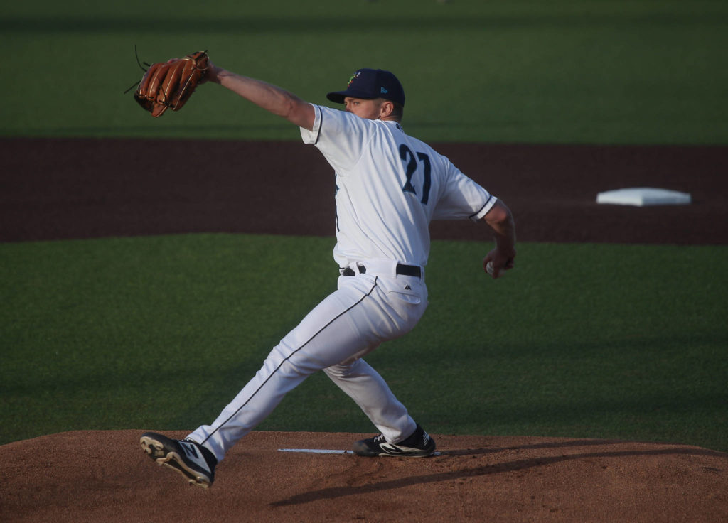 Aquasox’s Tim Elliott winds up as he pitches in the first inning as the Everett Aquasox beat the Tri-City Dust Devils in a home opening game at Funko Field on Tuesday, May 11, 2021 in Everett, Washington. (Andy Bronson / The Herald)