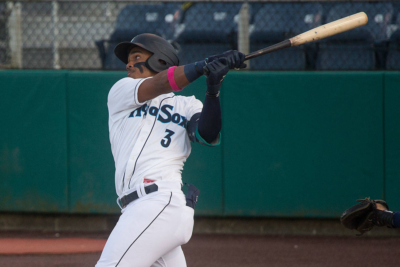 Aquasox's Julio Rodriguez hits a two run homer as the Everett Aquasox beat the Tri-City Dust Devils in a home opening game at Funko Field on Tuesday, May 11, 2021 in Everett, Washington.  (Andy Bronson / The Herald)