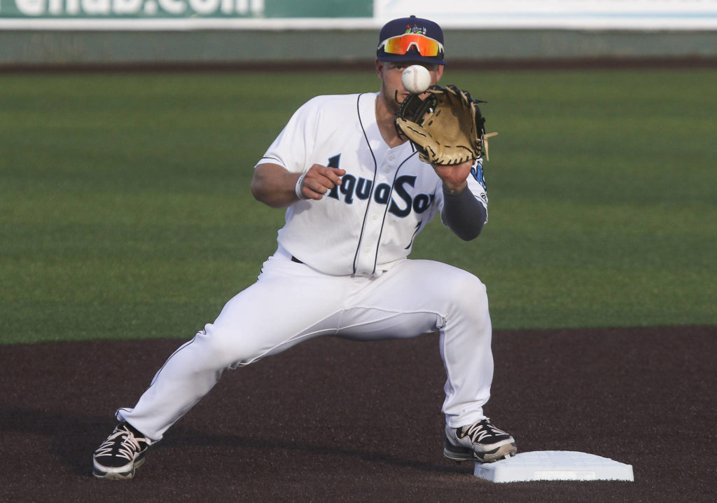 The AquaSox’s Kaden Polcovich keeps an eye on the ball and makes a double play during a game against the Dust Devils on May 11, 2021, at Funko Field in Everett. (Andy Bronson / The Herald)

