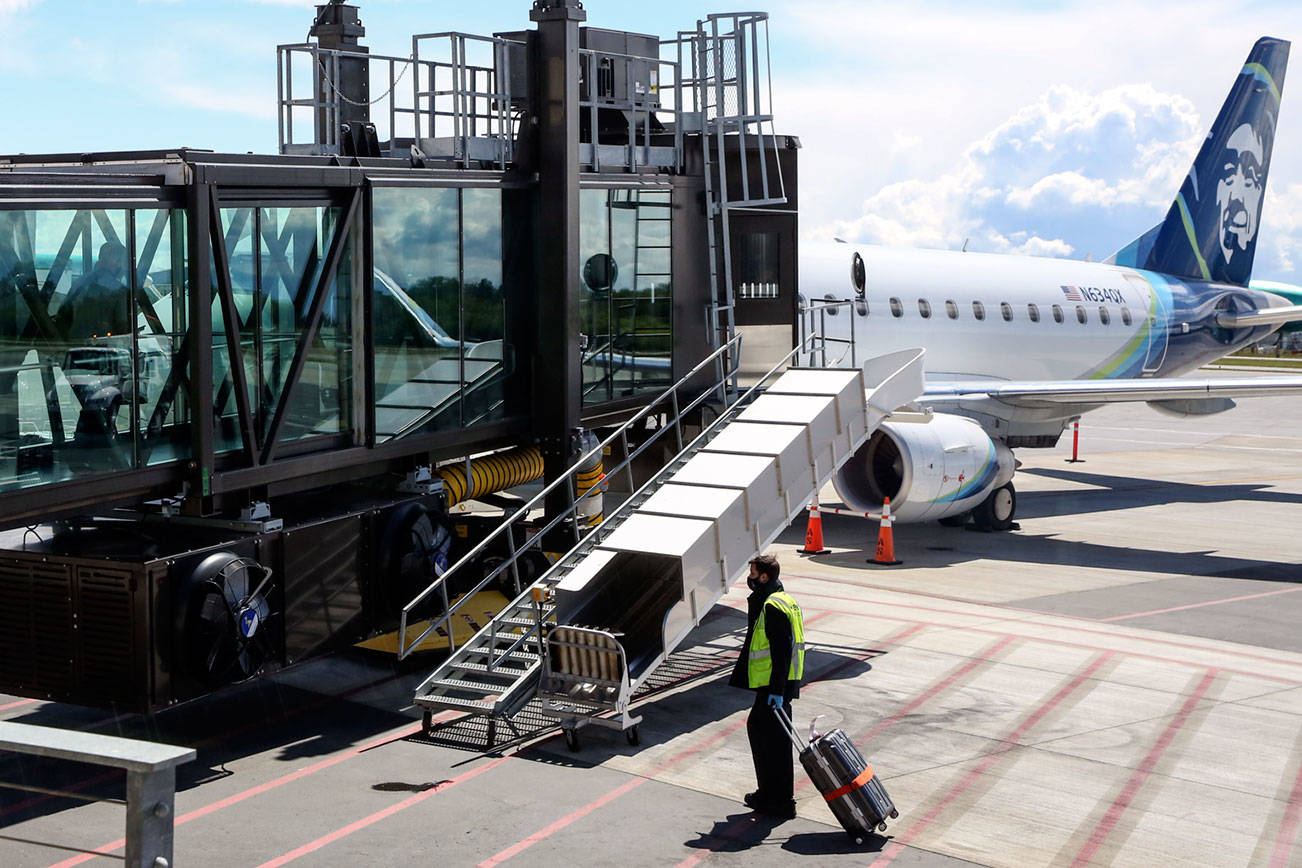 A flight to Las Vegas is boarding Wednesday afternoon at Paine Field in Everett on May 19, 2021.  (Kevin Clark / The Herald)