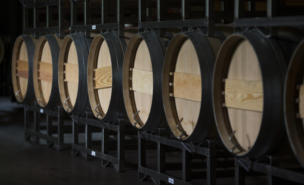 Barrels are lined up and stacked in the cellar at Quilceda Creek on Monday, May 17, 2021 in Snohomish, Washington. (Andy Bronson / The Herald)
