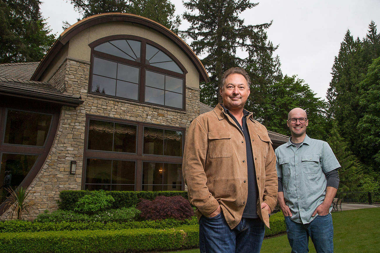 Paul Golitzin, president and director of winemaking, with winemaker Alex Stewart at Quilceda Creek on Monday, May 17, 2021 in Snohomish, Washington.  (Andy Bronson / The Herald)