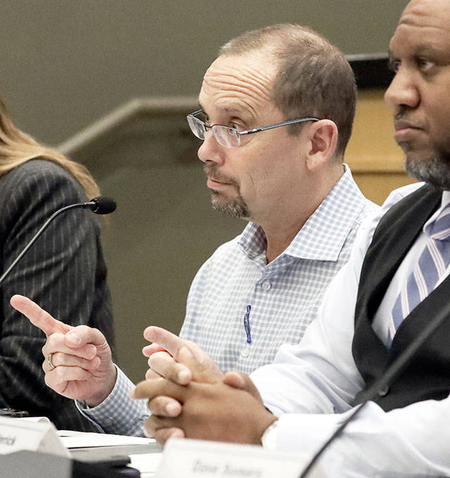 Dr. Chris Spitters (center) during a special meeting of the Snohomish Health District board in 2020. (Kevin Clark / Herald file)