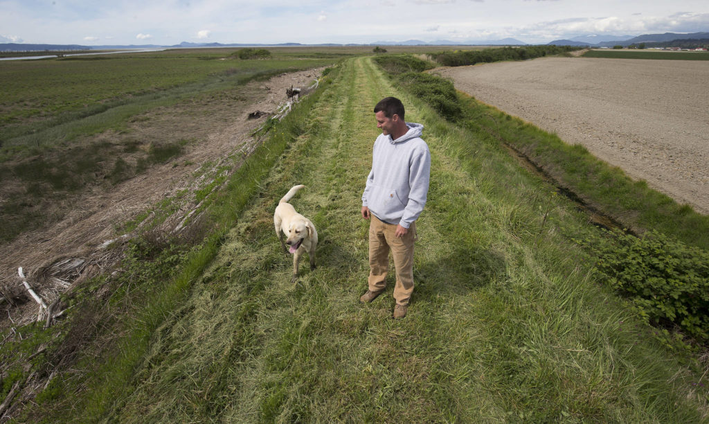 Tyler Breum and his dog Charlie. (Andy Bronson / The Herald)
