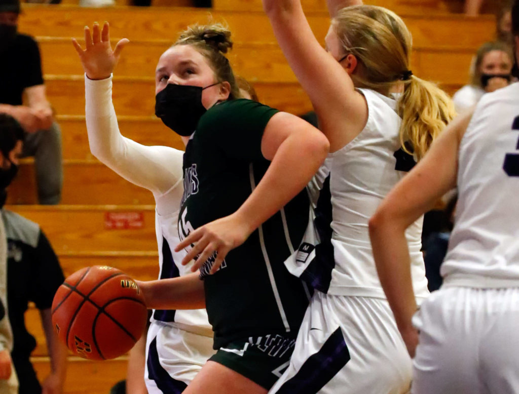 Edmonds-Woodway’s Halle Waram works the post during a game against Kamiak on May 14, 2021, at Kamiak High School in Mukilteo. (Kevin Clark / The Herald)
