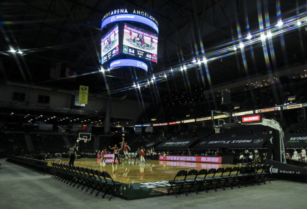 The Seattle Storm and Las Vegas Aces fight for a jump ball during a game on May 15, 2021, in Everett. (Olivia Vanni / The Herald)
