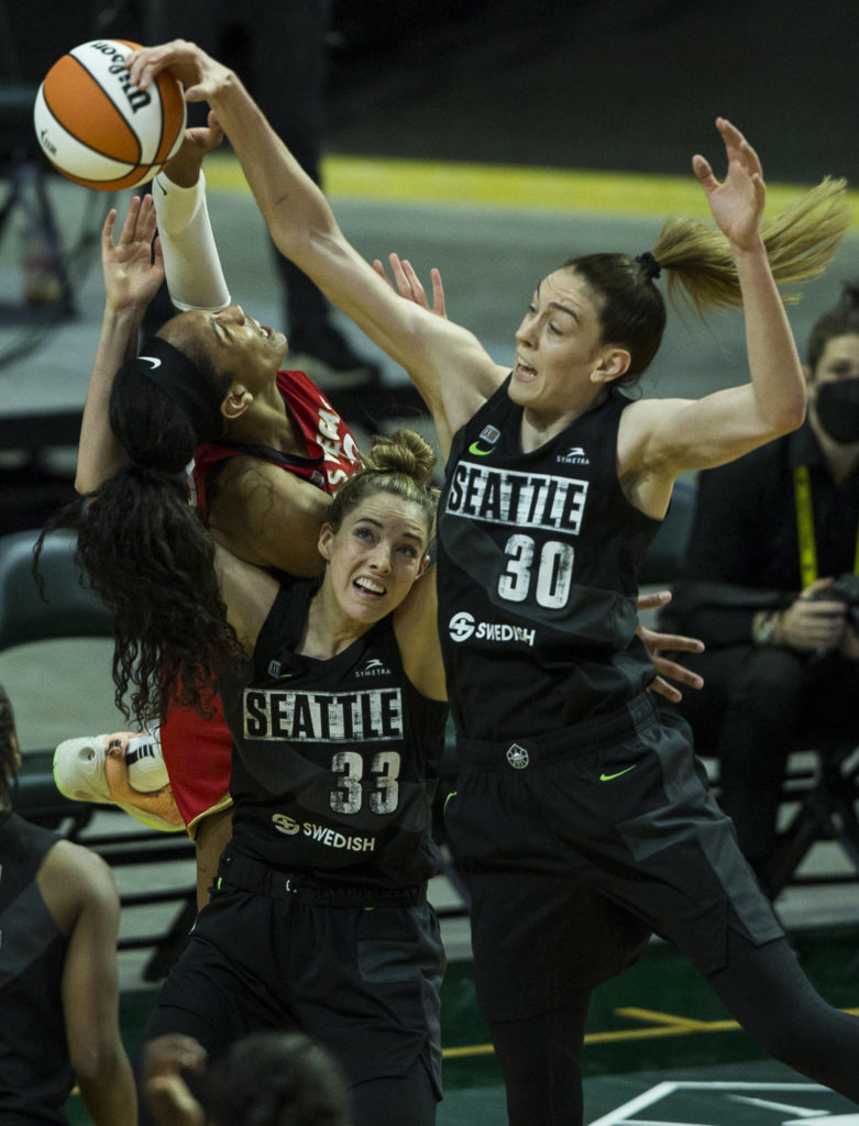 Seattle Storm’s Breanna Stewart and Katie Lou Samuelson fight for a rebound during a game agains the Las Vegas Aces on May 15, 2021, in Everett. (Olivia Vanni / The Herald)

