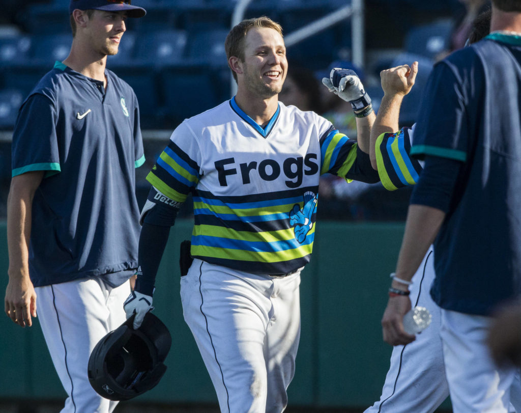 AquaSox’s Zach DeLoach is congratulated by his teammates after hitting a grand slam during the game against the Dust Devils on Sunday, May 16, 2021 in Everett, Wash.
