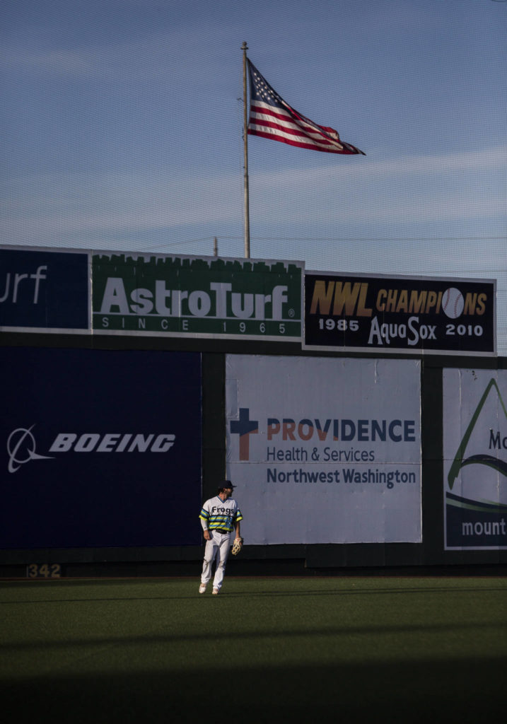 AquaSox’s Connor Hoover stands in the outfield during the game against the Dust Devils on Sunday, May 16, 2021 in Everett, Wash.
