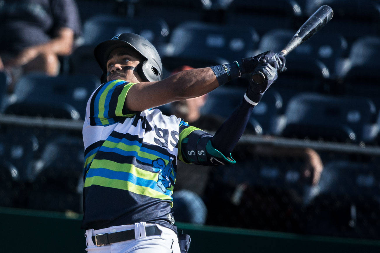 AquaSox's Julio Rodriguez watches the ball after hitting his fifth home run in six games on Sunday, May 16, 2021 in Everett, Wash.