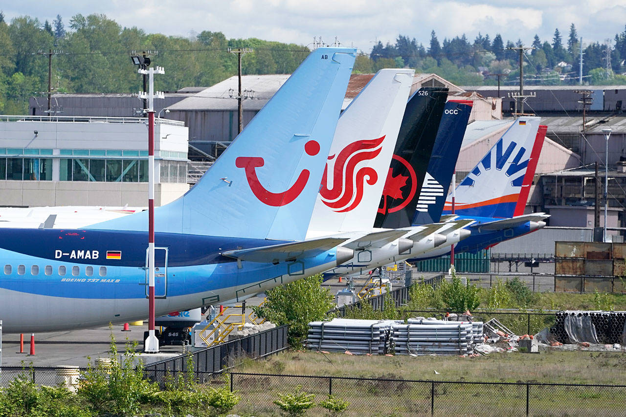 Boeing 737 Max airplanes sit parked at a storage lot near Boeing Field in Seattle on April 26. (AP Photo/Ted S. Warren)