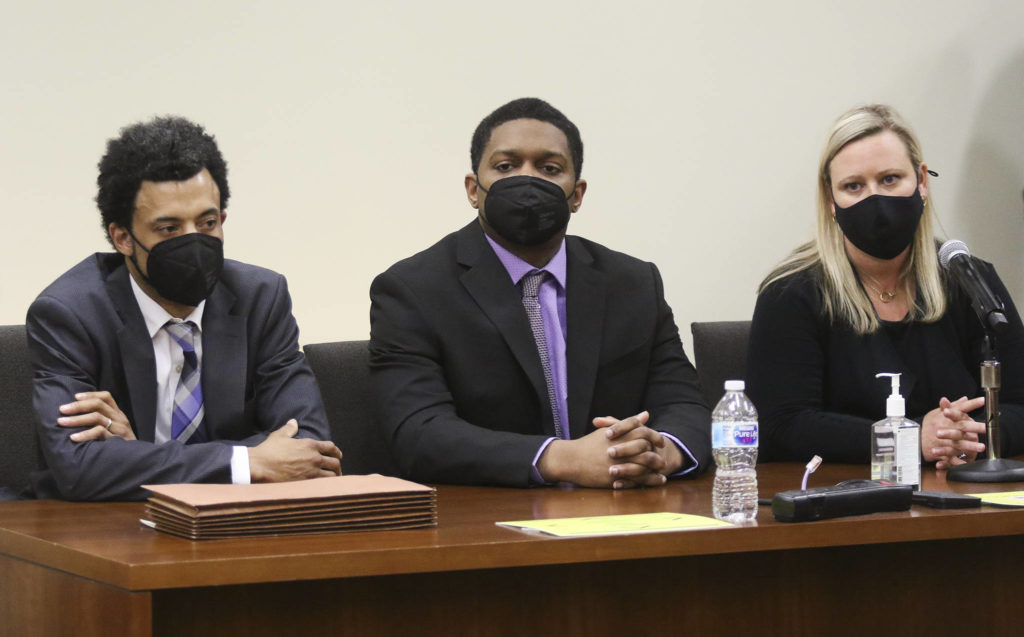 Jamel Alexander (center) listens Tuesday as a Snohomish County jury in Everett records its verdict of guilty in the first-degree murder of Shawna Brune. (Andy Bronson / The Herald)
