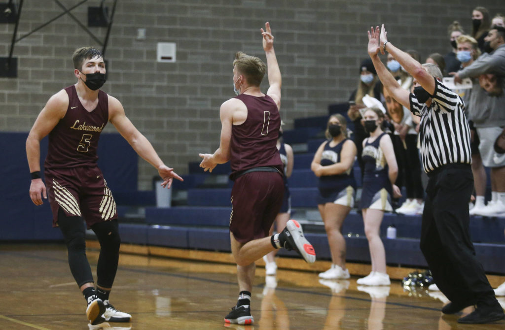 Lakewood’s Shae Dixon (1) holds up three fingers after scoring during a game against Arlington on May 19, 2021, in Arlington. (Andy Bronson / The Herald)
