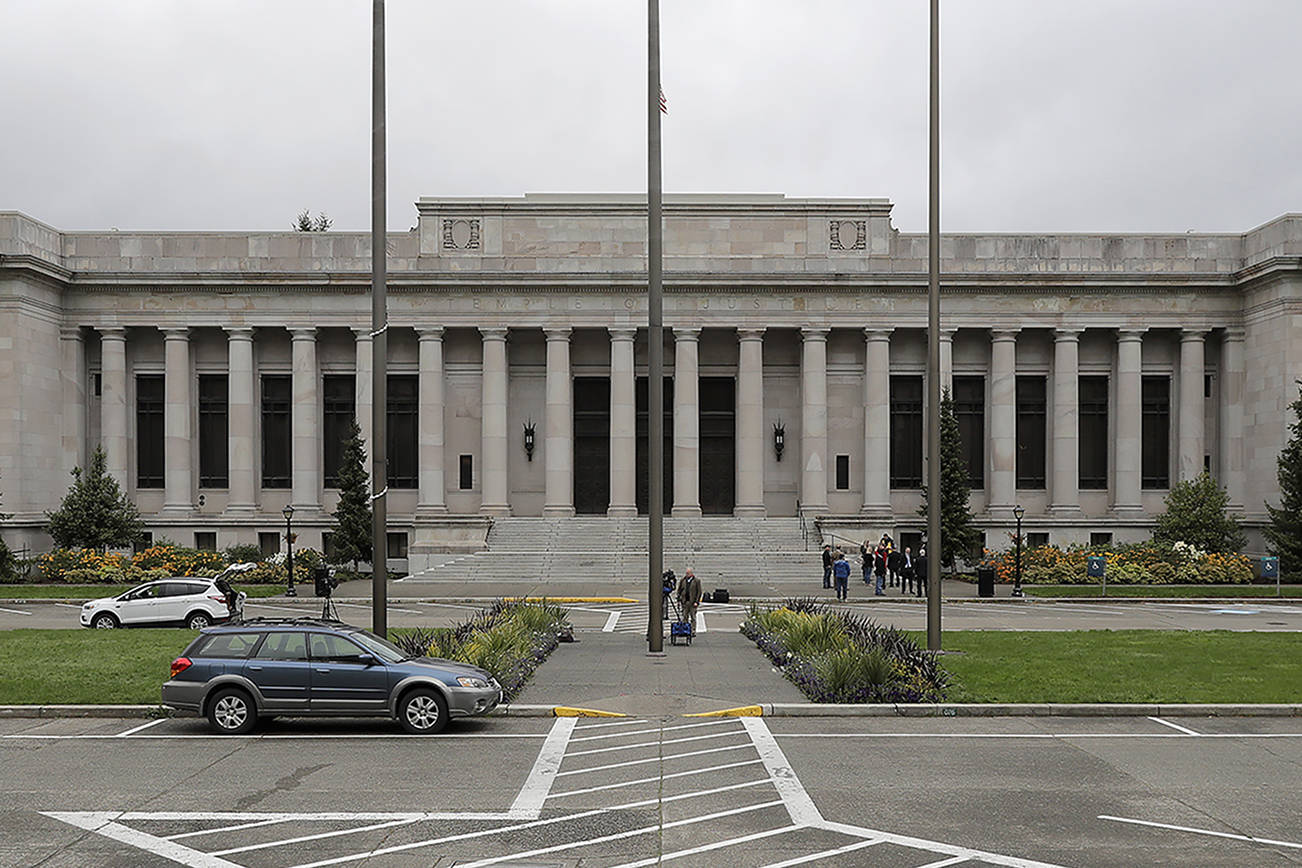 The Temple of Justice is shown Thursday, April 23, 2020, at the Capitol in Olympia, Wash., as Washington state Supreme Court justices hear oral arguments inside — but using remote video technology — in a case that addresses the safety of prison inmates during the coronavirus outbreak. Justices used remote video technology to conduct the court business and distance themselves from each other while broadcasting the arguments to viewers. During the hearing, lawmakers, law enforcement officials, and crime victims held a news conference to protest the release of some offenders. (AP Photo/Ted S. Warren)