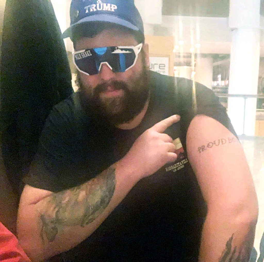 Daniel Scott, displaying a “Proud Boys” tattoo, in a photo from federal charging papers. (FBI) 
