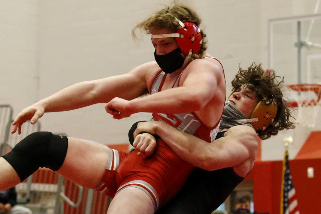 Lake Stevens’ Isiah Young (right) wrestles Stanwood’s Mason Ferguson during a match on May 20, 2021, at Stanwood High School. Lake Stevens won 48-33. (Kevin Clark / The Herald)
