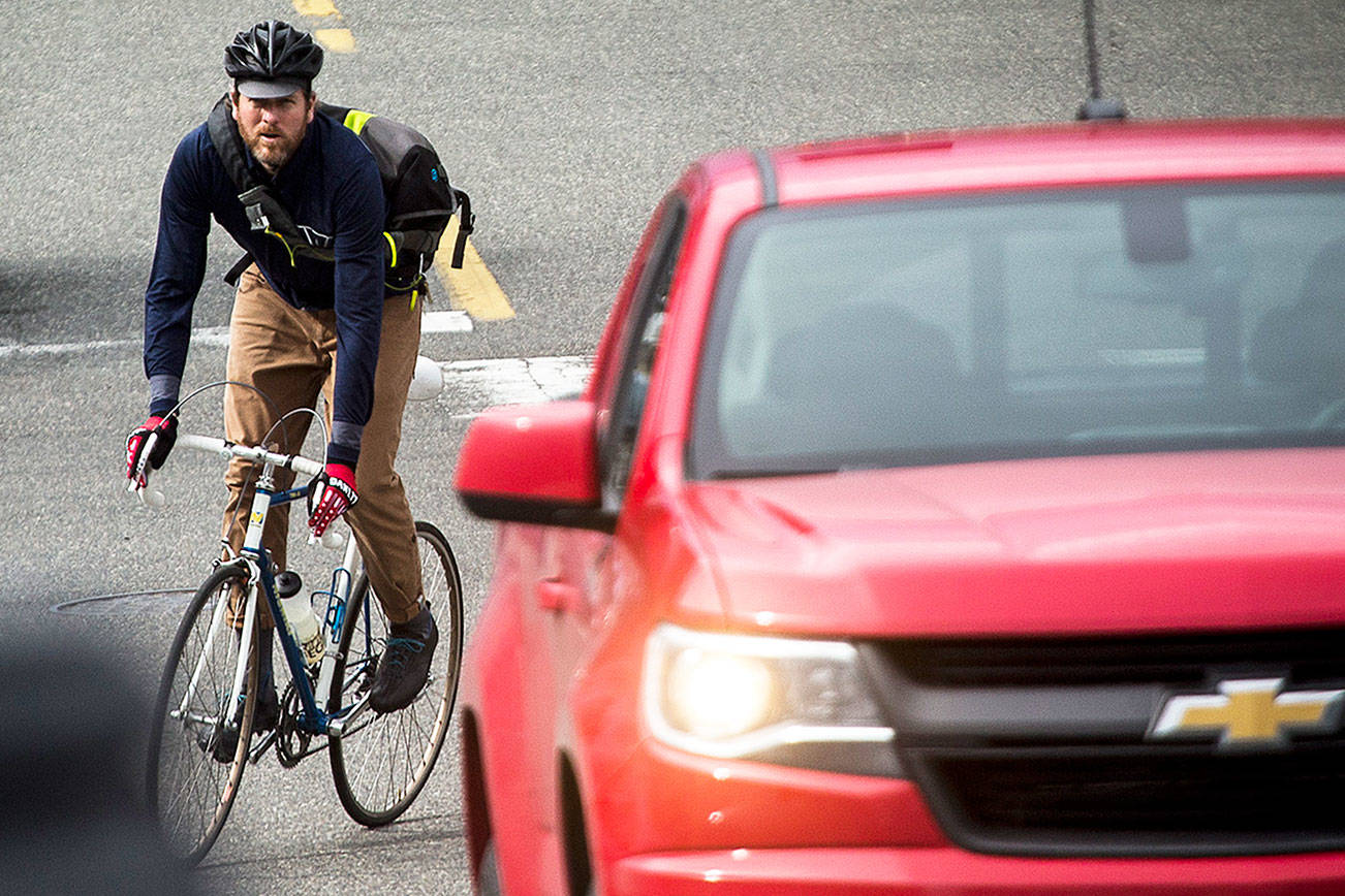 Ian Terry / The Herald

Warland Hewitt Wight rides through traffic in Everett on Tuesday, March 13. Wight, a full-time bicycle messenger, had his bike stolen and then recovered with the help of courthouse marshal, Mike Anderson.

Photo taken on 03132018