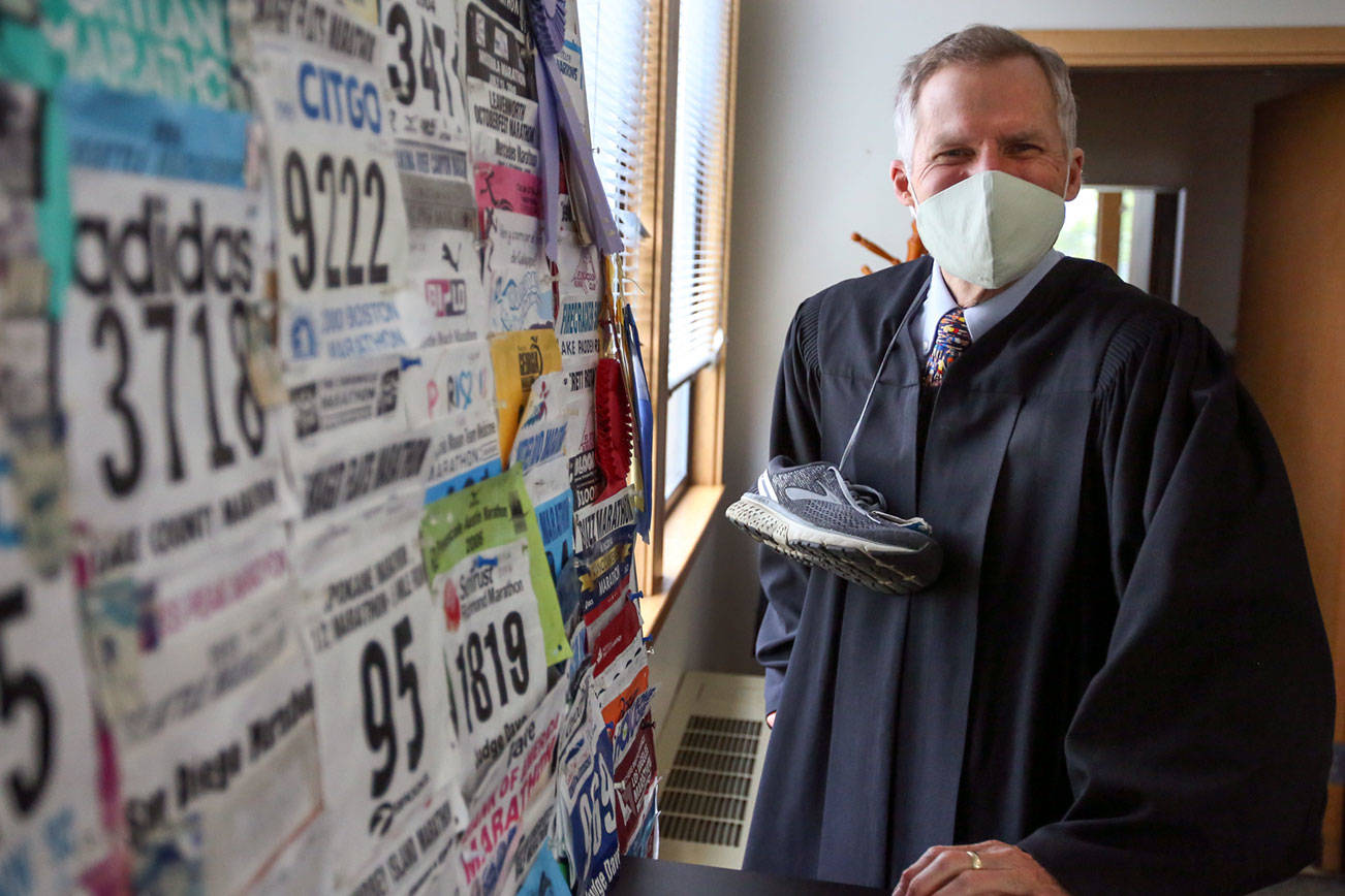 Judge David Kurtz of the Snohomish County Superior Court is retiring from the bench. He has run more than 90 marathons and among his favorite roles has been presiding over adoptions during National Adoption Day.  (Kevin Clark / The Herald)