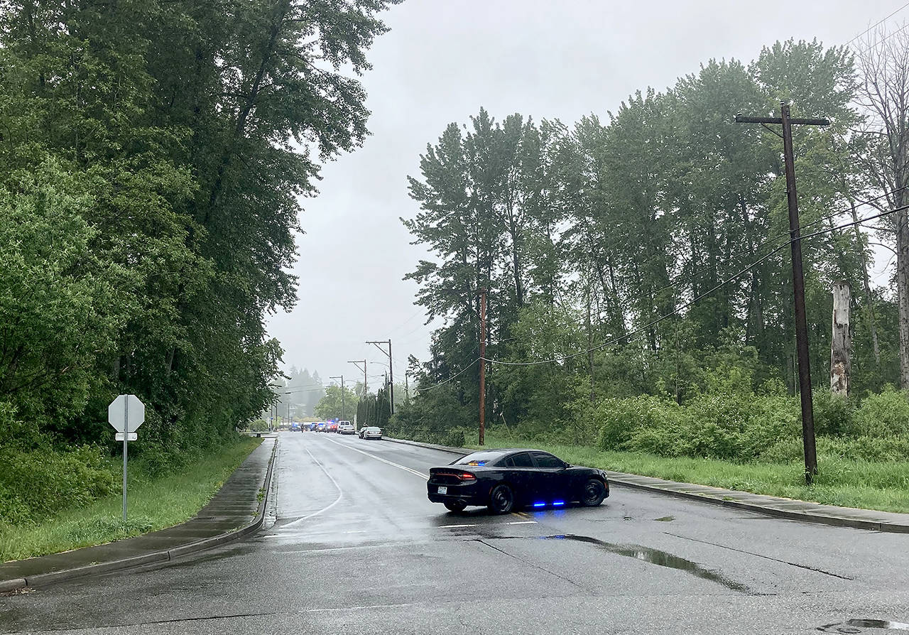 Police block a road while responding to a fatal shooting in Lake Stevens Monday morning. (Dakota Bair)