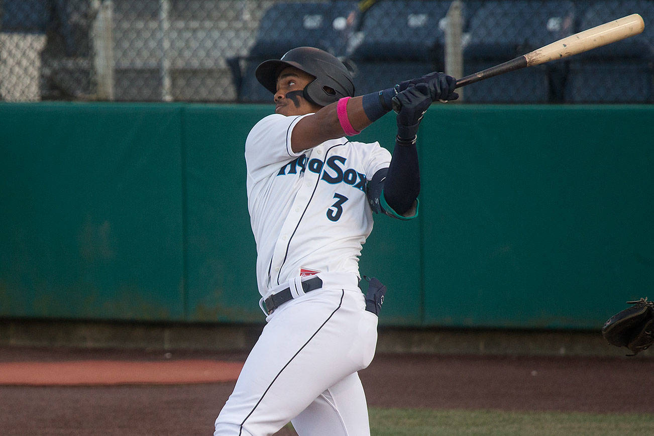 Aquasox's Julio Rodriguez hits a two run homer as the Everett Aquasox beat the Tri-City Dust Devils in a home opening game at Funko Field on Tuesday, May 11, 2021 in Everett, Washington.  (Andy Bronson / The Herald)